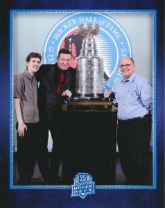 Collector Jeffrey Griffith and his father, Michael, pose with Gretzky. 